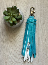 Load image into Gallery viewer, Clip Tassel- White and Teal Shimmer Cowhide Leather with Aquamarine Beaded Charm
