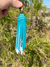 Load image into Gallery viewer, Clip Tassel- White and Teal Shimmer Cowhide Leather with Aquamarine Beaded Charm
